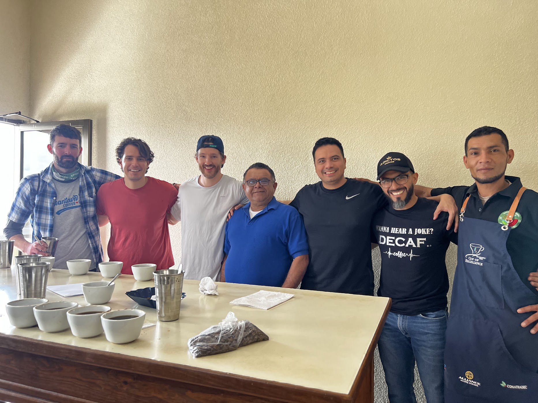 Kris Hehl and the producer team gathered at the cupping table during last year's Green Haven origin trip in Nicaragua